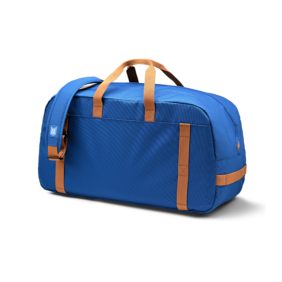 Ritual Calibre hockey duffle bag blue with brown straps, back view