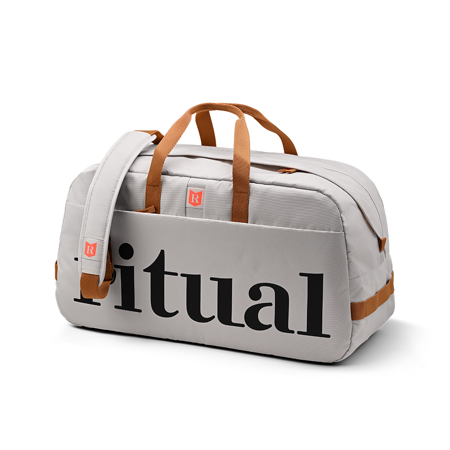 Ritual Calibre hockey duffle bag white with brown handles and straps, front and right side view