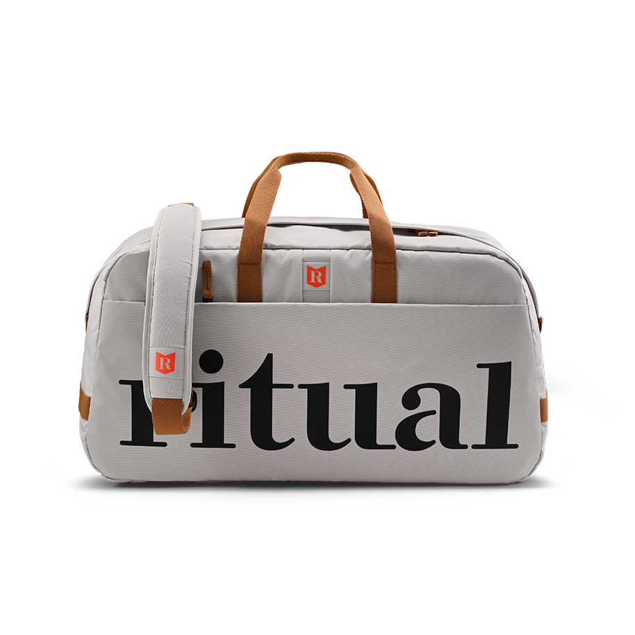Ritual Calibre hockey duffle bag white with brown handles and straps, full front view