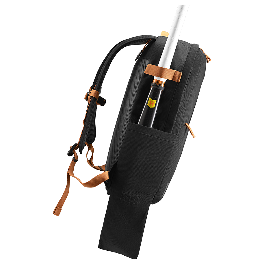 Ritual Covert hockey backpack black with brown straps and sticks, left side view