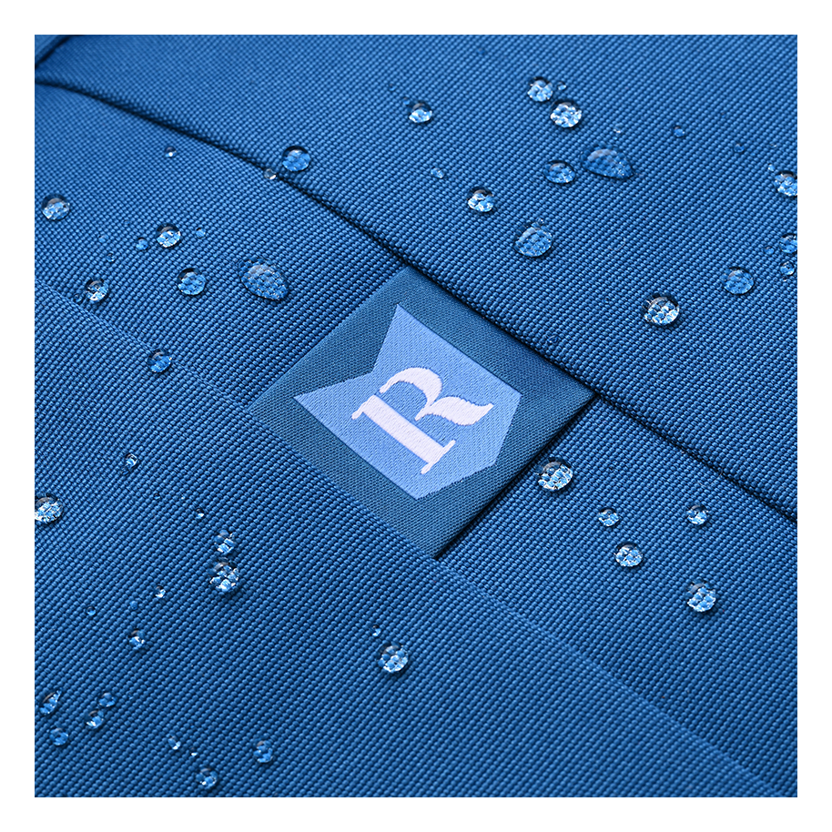 Ritual Covert hockey backpack blue with water droplets and a logo closeup view
