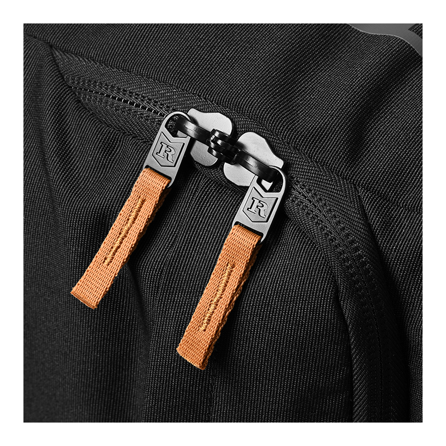 Ritual Mission combo hockey bag black with brown straps and metal buckles, close-up view