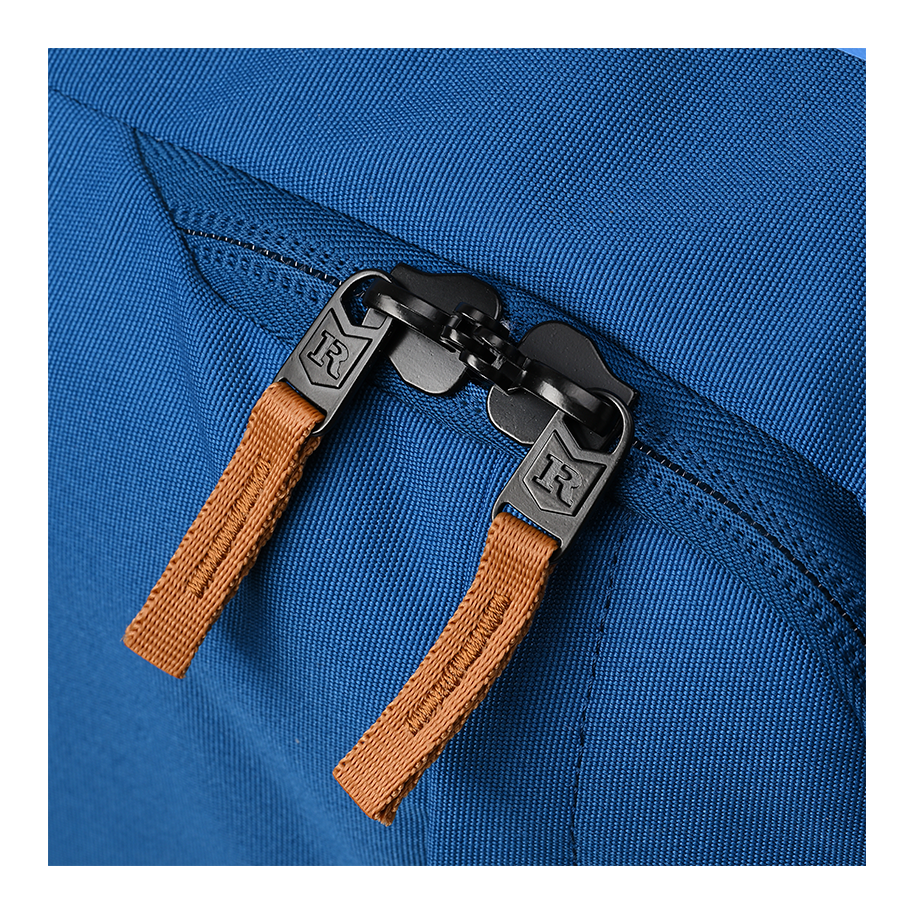 Ritual Mission combo hockey bag blue with brown zipper pulls and black zipper, close-up view