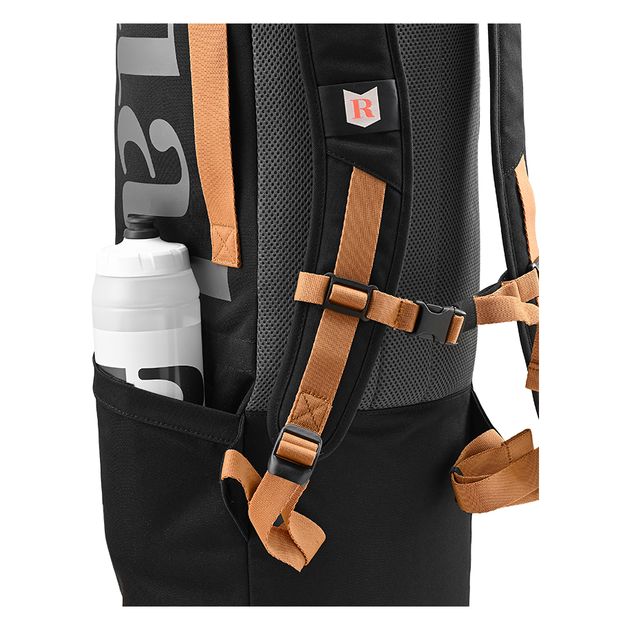 Ritual Tactic combo hockey bag black with brown straps and a water bottle inside, close-up view