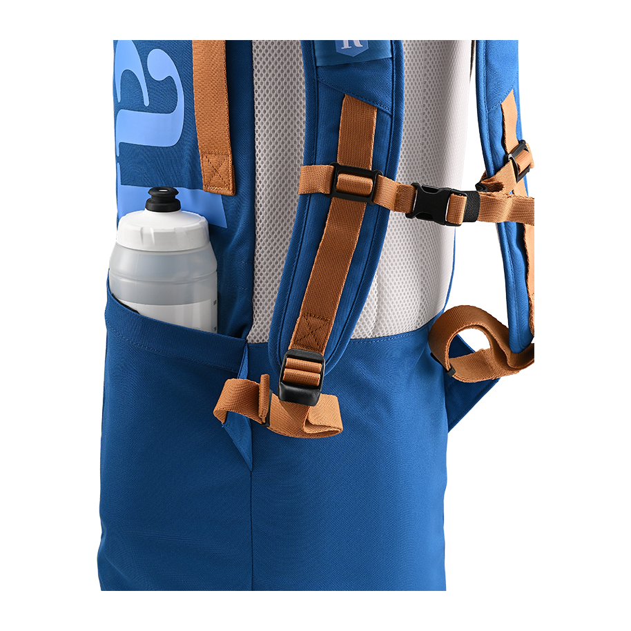 Ritual Tactic combo hockey bag blue with brown straps and a water bottle pocket, close-up view